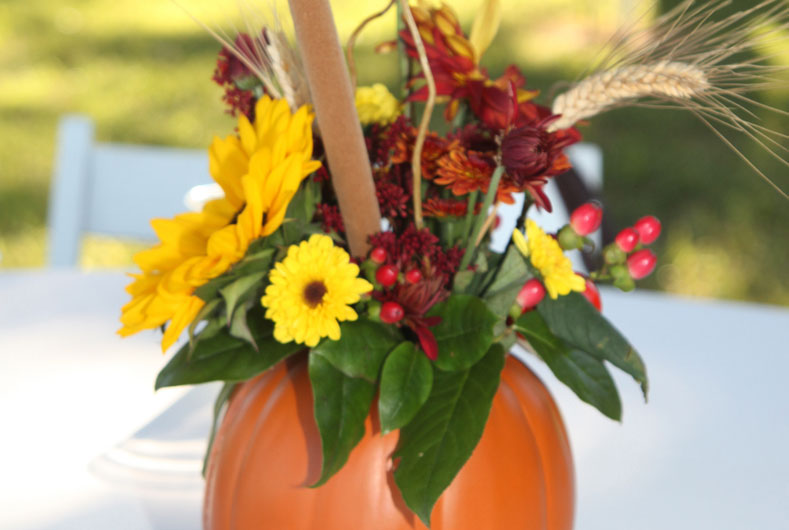flower centerpiece with a pumpkin vase